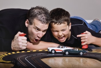 Father and son playing with cars