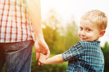 Child holding parent's hand